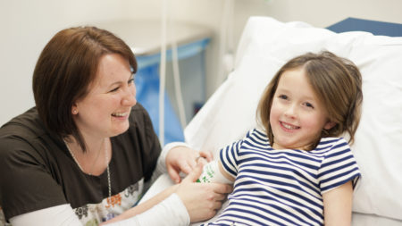UVA nurse with a pediatric patient