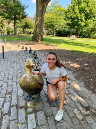 University of Virginia Kaelyn Cummins, MD, Surgery Resident poses next to a "Make Way for Ducklings" statue